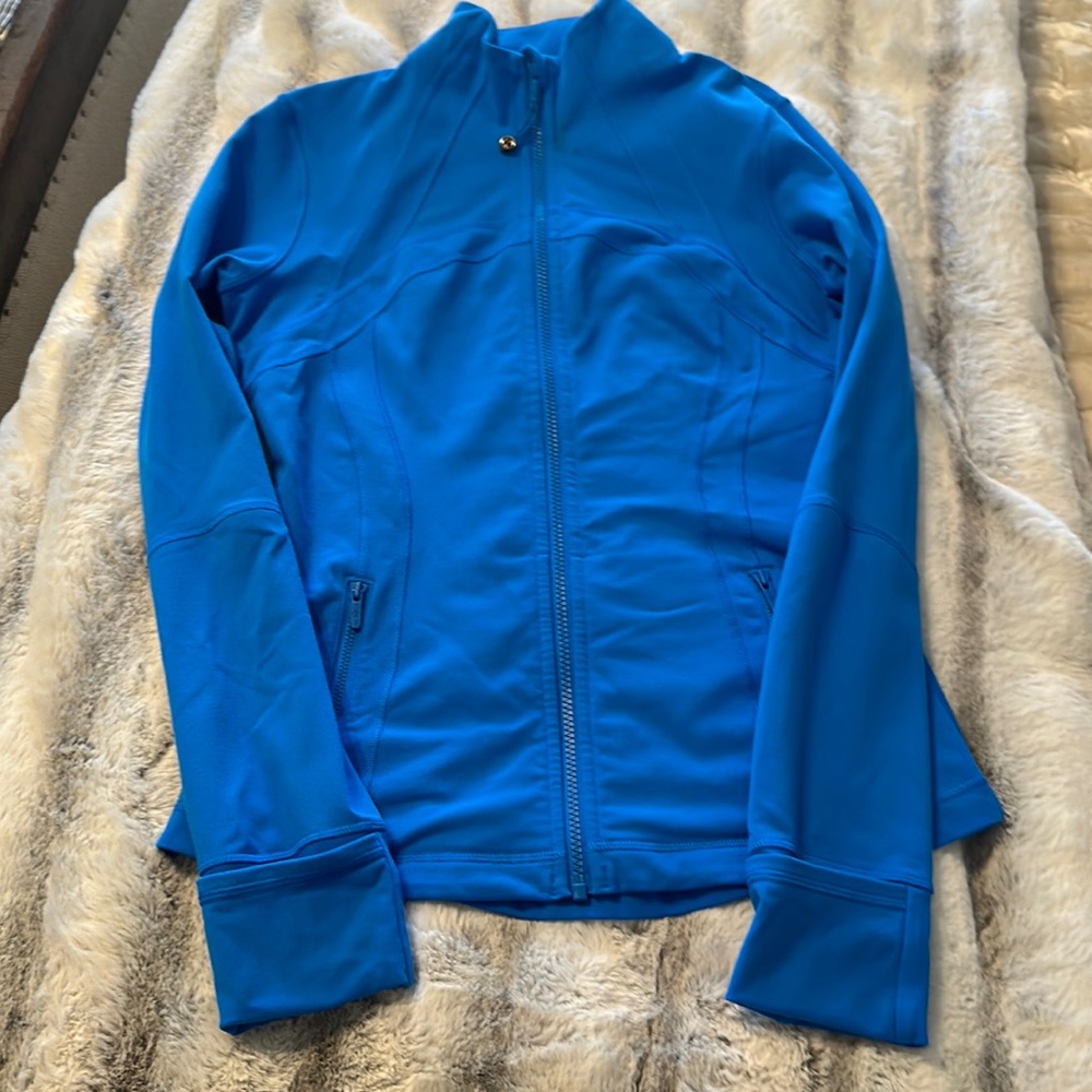 Lululemon define jacket. Size 12. Blue. Small stain on left zipper by neck